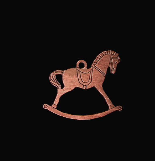 Rocking horse shaped copper pendant. Gift dedicated to Christmas and to children.