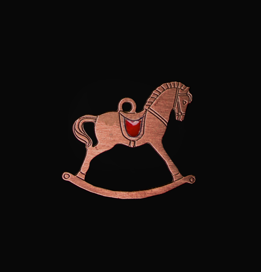 Rocking horse shaped copper pendant enamelled in red. Gift dedicated to Christmas and to children.