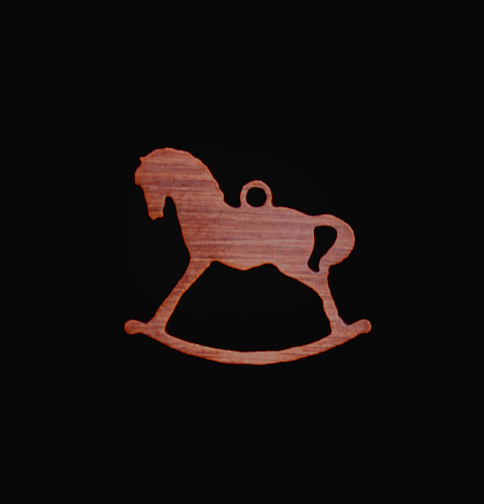 Rocking horse shaped copper pendant enamelled in red. Gift dedicated to Christmas and to children.